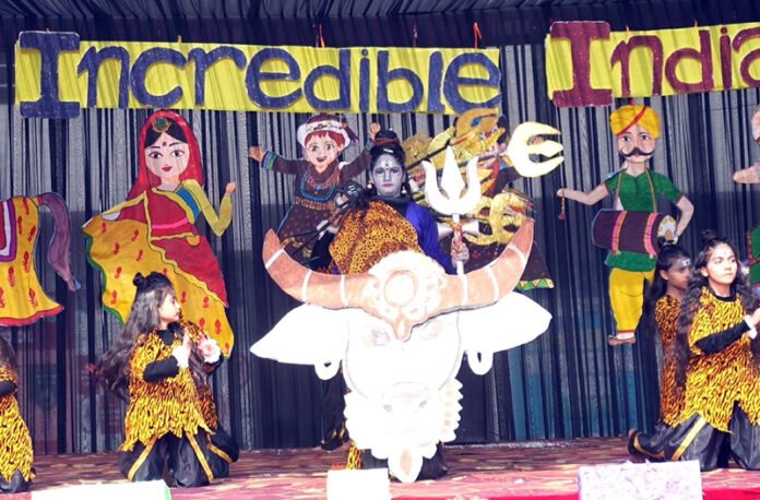 Students performing cultural item during a programme. Students performing cultural item during a programme.