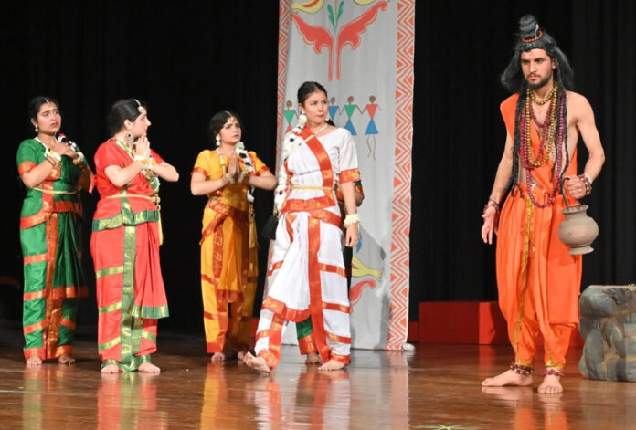 Artists performing during a play staged at 25th Bharat Rang Mahotsav.
