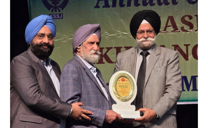 Prominent Punjabi litterateur, Bhupinder Singh Raina receiving memento during a function at Abhinav Theatre.