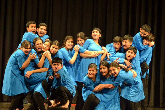Artists performing during a play staged by Natrang in Jammu.