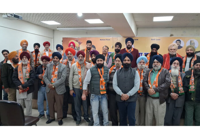 Ranjodh Singh Nalwa (State president, BJP Minority Morcha) posing with newly elected District Jammu South Morcha team at party headquarters, Trikuta Nagar, Jammu.