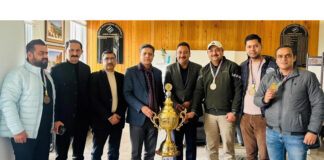 Team members and others posing along with Sanjeev Verma, Chief Election Commissioner, J&K.
