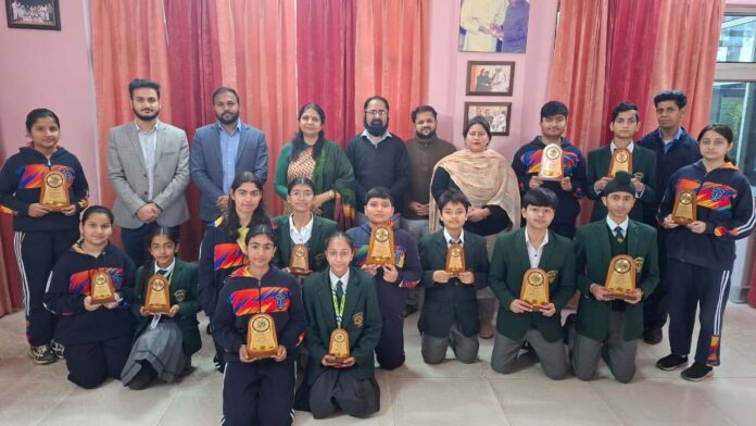 Winners posing for group photograph with dignitaries.