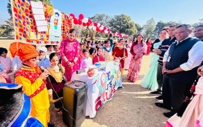 Dignitaries along with students during a programme.