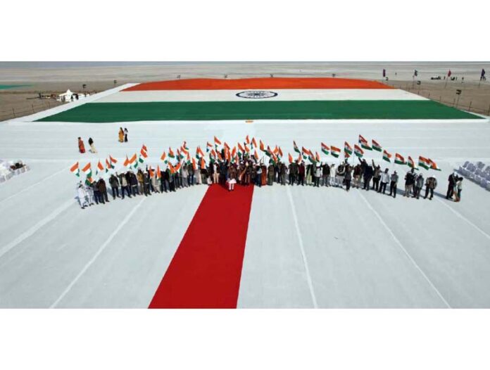 Dignitaries at an event to display world's largest Khadi Tricolour in Rann of Kutch.