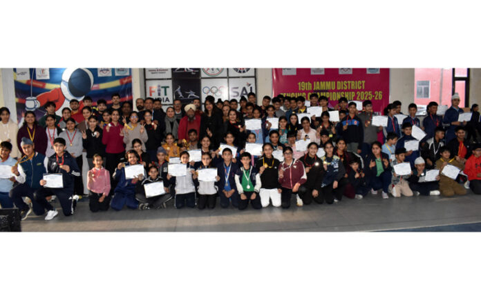 Winners and others posing for a group photograph on the conclusion of 19th Jammu District Fencing Championship at M.A Stadium.
