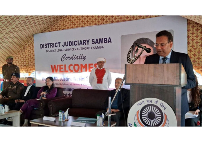 Justice Wasim Sadiq Nargal speaking during a function organized by District Judiciary at Samba on Wednesday.
