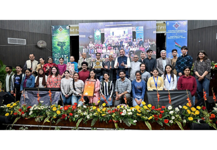 Dignitaries posing along with students during a function in Jammu.