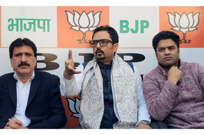 BJP spokesperson Dr Abhijeet Jasrotia along with other party leaders during a press conference in Srinagar on Tuesday. — Excelsior/Shakeel