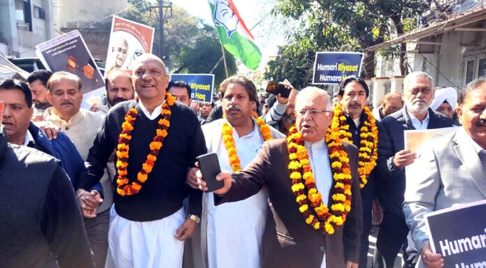 Senior Cong leaders moving towards DC office in Jammu on Saturday.