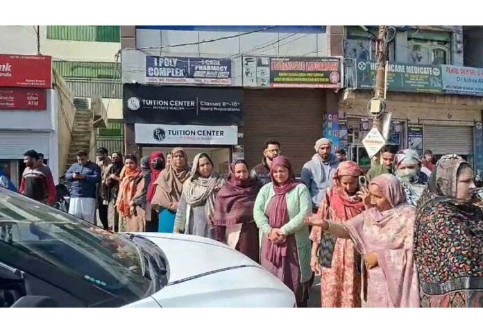 People protesting near GMC in Kheora area of Rajouri on Tuesday. -Excelsior/Imran