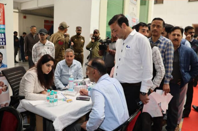 Doctors attending to Crime Branch officials during a multispecialty medical camp at Jammu.