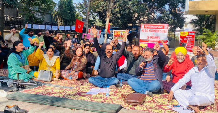 Insurance employees staging protest in Jammu on Thursday.