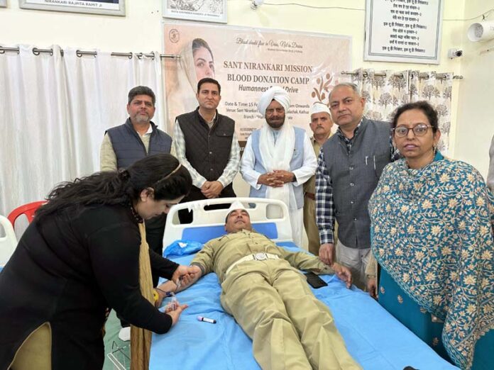 A volunteer donating blood at a camp organized by Sant Nirankari Mission at Dayalachak on Sunday.