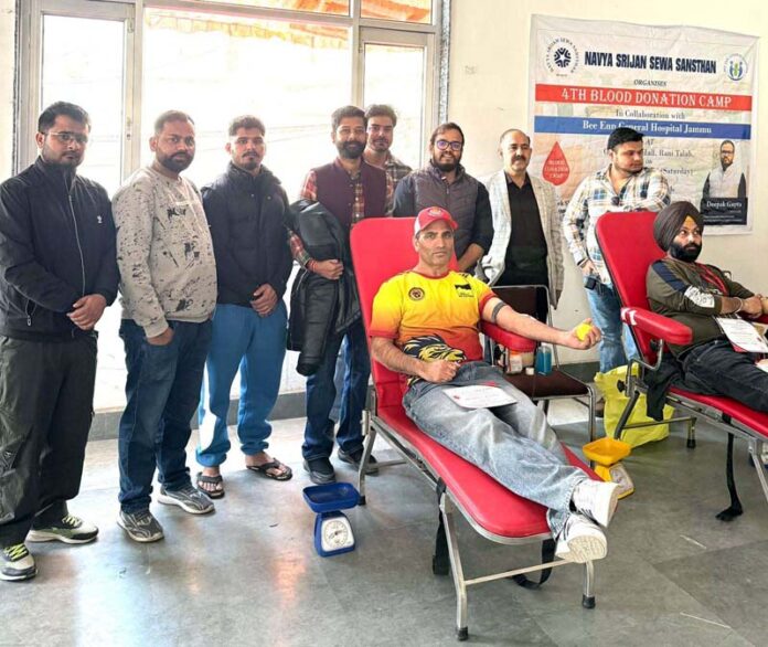 A volunteer donating blood at a blood donation camp at Bee Enn General Hospital , Jammu on Sunday.