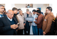 Dr Farooq Abdullah handing over the keys of a car to a customer at AM Hyundai Jammu on Tuesday.