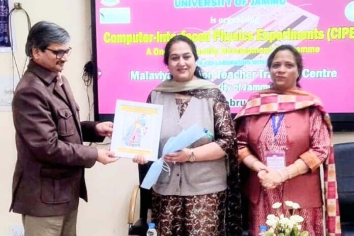 A dignitary presenting a certificate to a FDP participant at University of Jammu. A dignitary presenting a certificate to a FDP participant at University of Jammu.