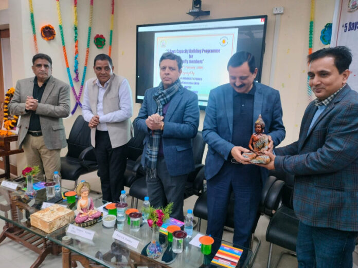 Memento being presented to guests during inaugural of five-day Faculty Capacity Building workshop at JU. Memento being presented to guests during inaugural of five-day Faculty Capacity Building workshop at JU.