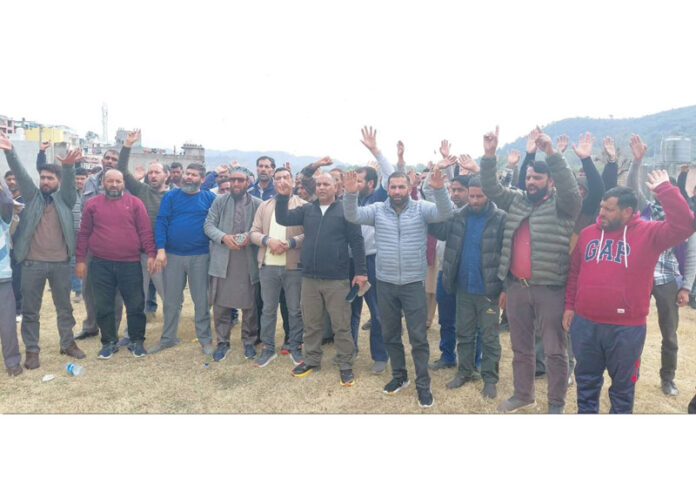 PHE workers staging protest against Govt at Rajouri on Monday. —Excelsior/Imran