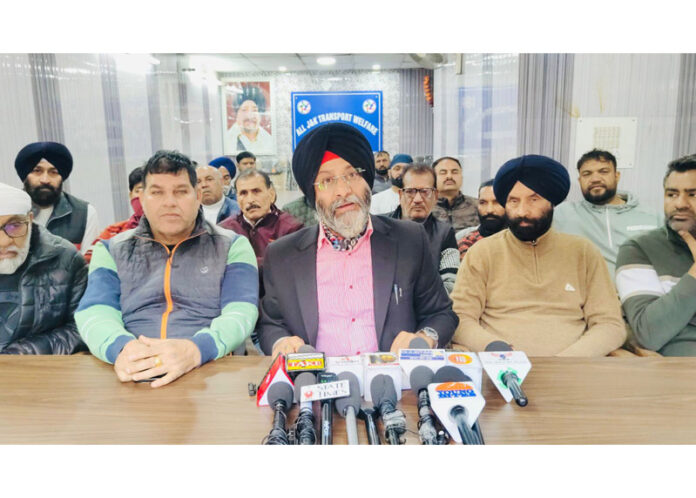 AJKTWA’s chief patron, Parvinder Singh, flanked by various union heads, addressing press conference in Jammu.