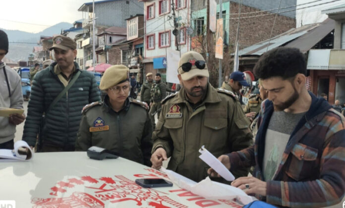 Cops during a drive to check traffic violations in Bhadarwah on Tuesday.