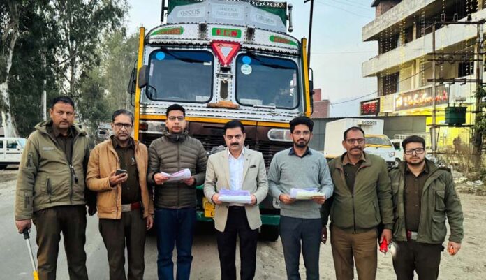 State Taxes Enforcement Team, Udhampur posing for a photograph with the intercepted vehicle carrying mixed scrap on Thursday. State Taxes Enforcement Team, Udhampur posing for a photograph with the intercepted vehicle carrying mixed scrap on Thursday.