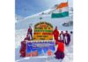 Buddhist monks displaying a banner at Khardong La Pass to thank their counterparts who are undertaking a peace walk in the US.