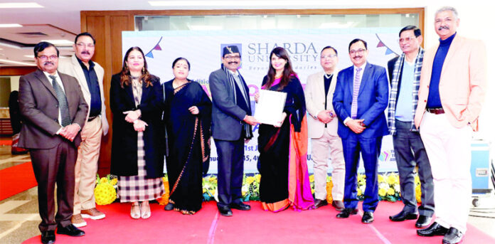 A teacher being awarded at Sharda University in Greater Noida on Saturday. A teacher being awarded at Sharda University in Greater Noida on Saturday.