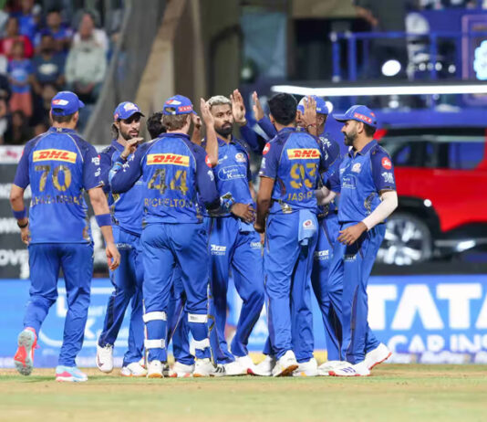 Mumbai Indian players celebrating after taking wicket against KKR in Mumbai on Sunday.