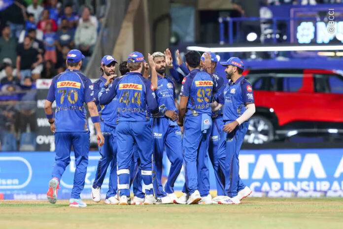 Mumbai Indian players celebrating after taking wicket against KKR in Mumbai on Sunday.