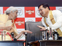 Union Finance Minister Nirmala Sitharaman, left, and Union Minister of Ports, Shipping and Waterways Sarbananda Sonowal during the Bharatiya Janata Party Assam unit's election manifesto release ahead of the state Assembly elections, at the party's state headquarters, in Guwahati.