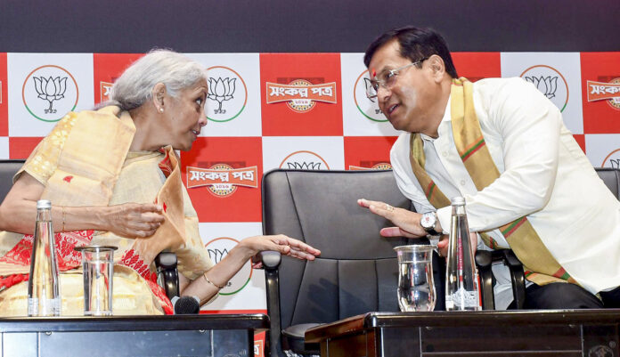 Union Finance Minister Nirmala Sitharaman, left, and Union Minister of Ports, Shipping and Waterways Sarbananda Sonowal during the Bharatiya Janata Party Assam unit's election manifesto release ahead of the state Assembly elections, at the party's state headquarters, in Guwahati.