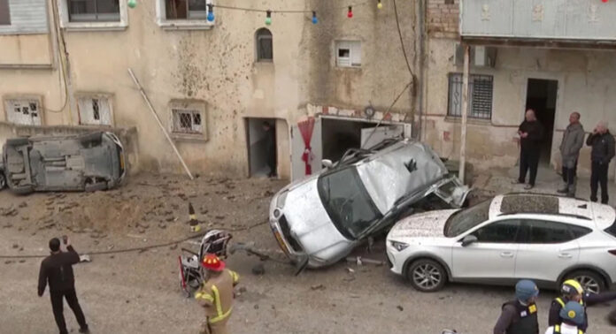 People look at destroyed cars in Israel after Iran’s strike on Thursday. People look at destroyed cars in Israel after Iran’s strike on Thursday.