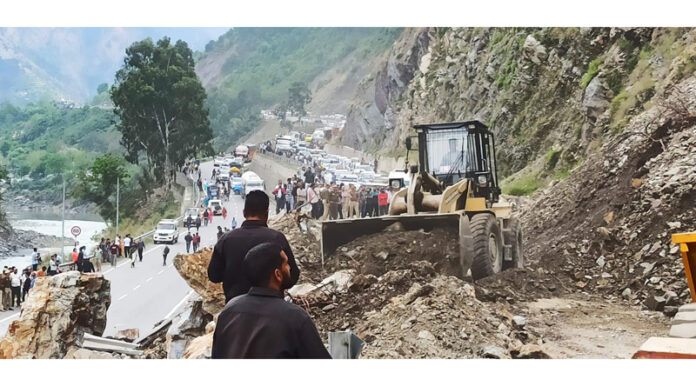 A machine clearing highway near Ramban on Thursday. -Excelsior/Parvaiz Mir