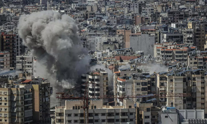 Smoke rises from the site of an Israeli airstrike that targeted an area in Beirut’s southern suburbs on Tuesday. Smoke rises from the site of an Israeli airstrike that targeted an area in Beirut’s southern suburbs on Tuesday.