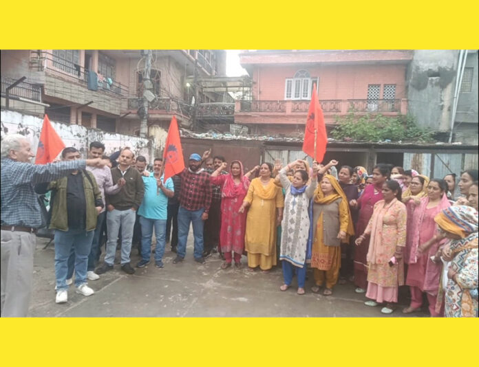 Workers of Hindustan Pencils Pvt Ltd raising slogans during a protest in Jammu on Wednesday.