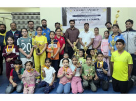 Young Table Tennis players posing along with dignitaries during prize distribution ceremony.