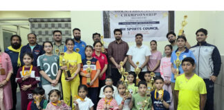 Young Table Tennis players posing along with dignitaries during prize distribution ceremony.
