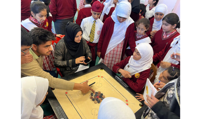 Players participating during inaugural event of District Carrom Championship in Baramulla.