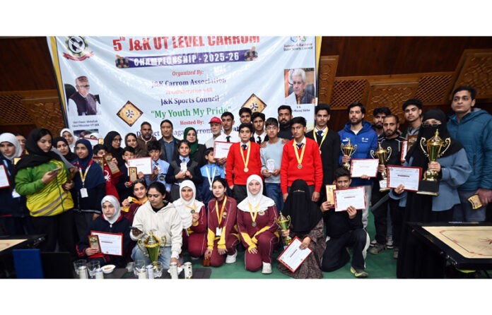 Winners posing along with trophies during prize distribution ceremony.