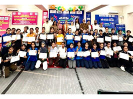 Students posing along with dignitaries during a programme.