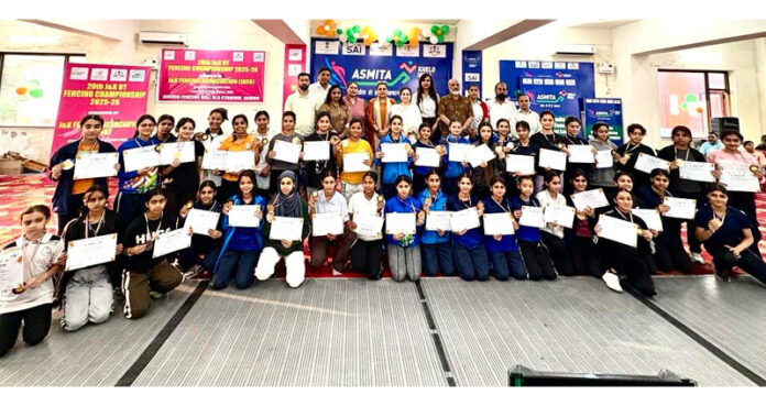 Students posing along with dignitaries during a programme.