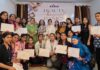 Participants posing for a group photograph along with certificates during workshop.