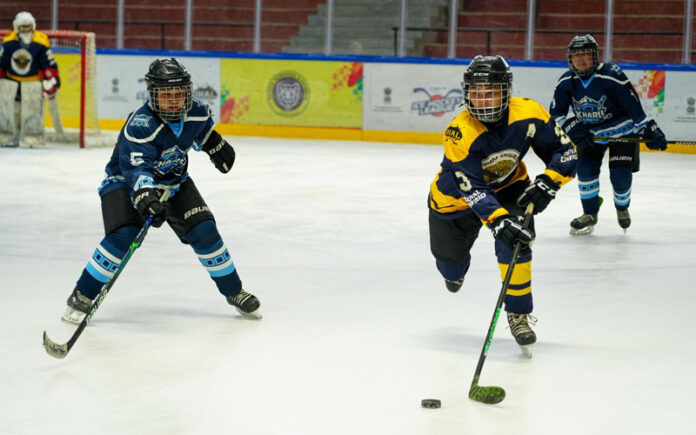 Ice Hockey players in action during a march.