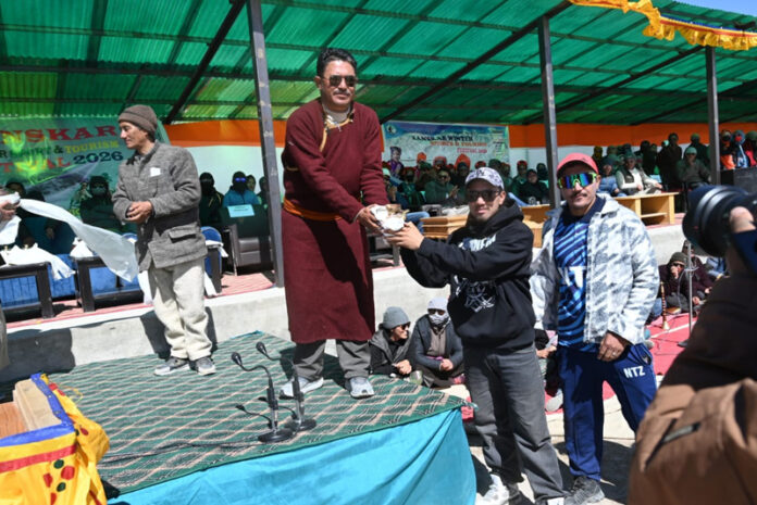 Councillor Karsha, Stanzin Jigmath, presenting trophy to a participant at Zanskar Winter Sports and Tourism Festival.