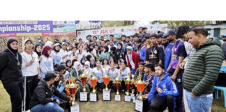 Winning teams posing along with trophies and dignitaries.