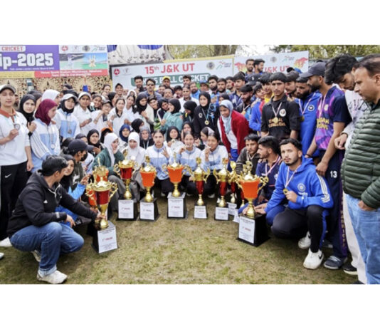 Winning teams posing along with trophies and dignitaries.