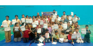 Winners posing along with dignitaries during prize distribution ceremony.