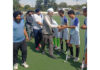 Dignitaries interacting with players before start of match.