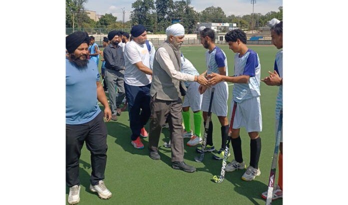 Dignitaries interacting with players before start of match.
